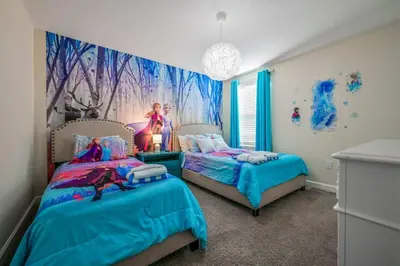 a bedroom with two beds and a princess mural at Disney Bliss Themed Rooms Game Room Private Pool in Kissimmee