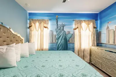 a bedroom with the statue of liberty painted on the wall at Enchanting a Magical Orlando Trip in Kissimmee