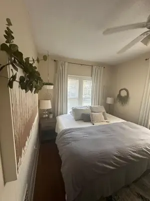 a bedroom with a white bed and a window at Beautiful Private Room With King Size Bed in Downtown Orlando in Orlando