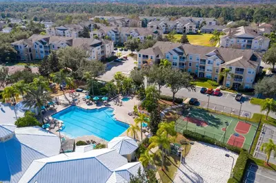an aerial view of a pool at a resort at Immaculate 4 bedrooms 3 bathroom in Windsor Palms in Kissimmee