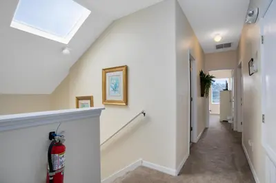 a hallway of a home with a skylight at Tropical and peaceful, this 5 bed with Pool & Spa in Orlando