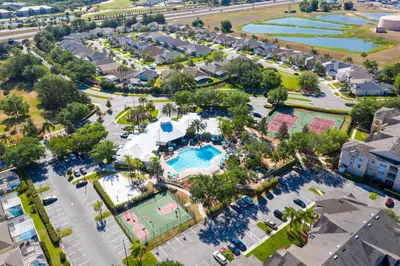 an overhead view of a pool at a resort at Fantastic Resort 5BR House - South Facing Pool/Spa in Kissimmee