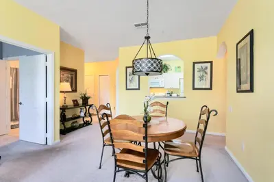 a dining room with a table and chairs at Close to Disney Condo 3 Bed / 2 Bath in Kissimmee