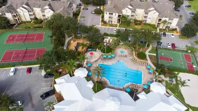 an aerial view of a pool at a resort at Amazing Resort 2 bed condo close to Disney in Kissimmee