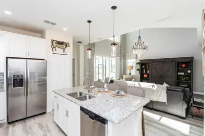a kitchen with a sink and a counter top at Five bedroom home is ideal for an elegant vacation in Kissimmee