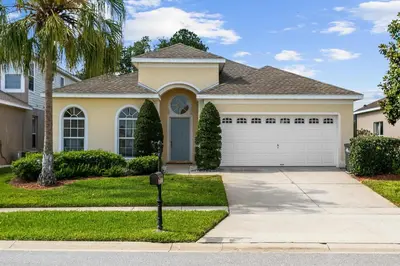 a house with a parking meter in front of it at South Facing Pool 4 Bedroom 3 Bath Villa in Kissimmee
