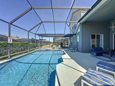 a house with a swimming pool with a glass roof at Amazing 6 Bed Disney Dream Getaway in Windsor Palm in Kissimmee