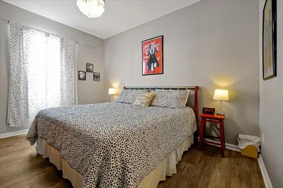 a bedroom with a bed with a checkered blanket at Making Memories Resort Windsor Palms Condo in Kissimmee