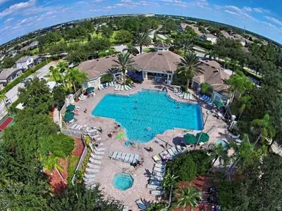 an aerial view of a pool at a resort at Making Memories Resort Windsor Palms Condo in Kissimmee