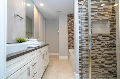 a bathroom with a sink and a shower at 5 Min to Disney Dream 5 Suites Villa in Orlando