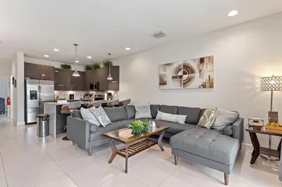 a living room with a couch and a table at Priceless Peace At Serenity By Shine Villas 081 in Orlando