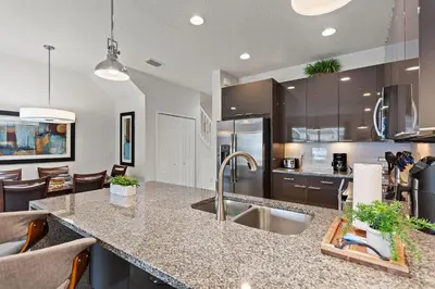 a kitchen with a sink and a counter top at Priceless Peace At Serenity By Shine Villas 081 in Orlando