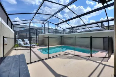 a swimming pool inside of a building with a glass ceiling at Plush Pelican, At Storey Lake By Shine Villas #839 in Kissimmee