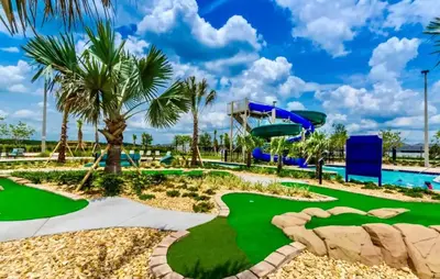 a miniature golf course at a resort with a slide at Fireworks Night -Storey Lake By Shine Villas #709 in Kissimmee