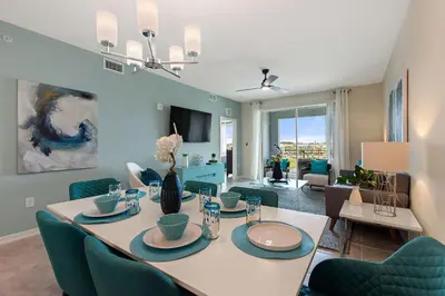 a dining room with a table and chairs at Resort Life At Storey Lake By Shine Villas #702 in Kissimmee