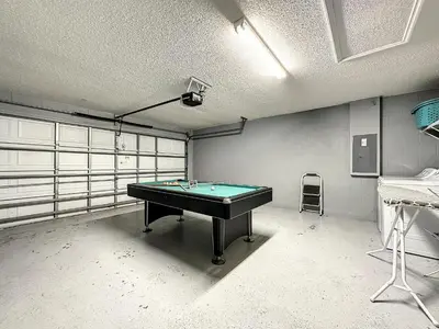 a room with a pool table in it at Emerald Island 4 bed mins to Disney in Kissimmee