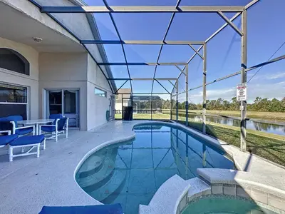 an indoor swimming pool with a glass roof at Emerald Island 4 bed mins to Disney in Kissimmee