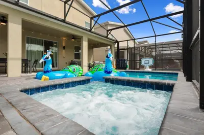 a pool in a house with a gym with a mermaid theme at Luxury 9BR Gem- Heated Pool, Theater & Theme Rooms in Kissimmee