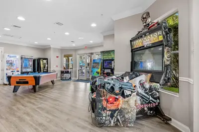a room with a video game system and a pool table at Prime Location 3 Suites Townhome Near Universal in Orlando