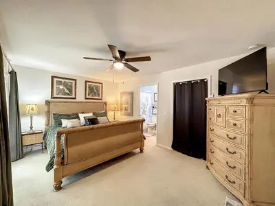 a bedroom with a bed and a ceiling fan at Lovely 3 bed Condo Near Disney Quiet Community in Kissimmee