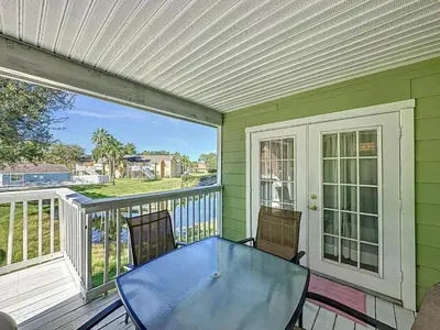 a patio with a glass table and chairs on a balcony at Lovely 3 bed Condo Near Disney Quiet Community in Kissimmee