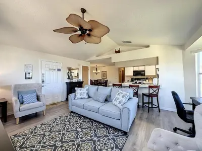 a living room with a couch and a ceiling fan at Lovely 3 bed Condo Near Disney Quiet Community in Kissimmee