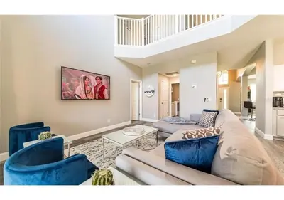 a living room with a couch and two chairs at The Minions Mansion 6br Resort Pool Home By Disney in Kissimmee
