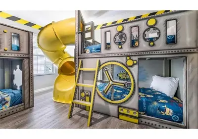 a childs room with a slide and a clock at The Minions Mansion 6br Resort Pool Home By Disney in Kissimmee