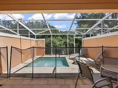 a swimming pool in a building with a glass ceiling at MEMO Vacation House in Orlando