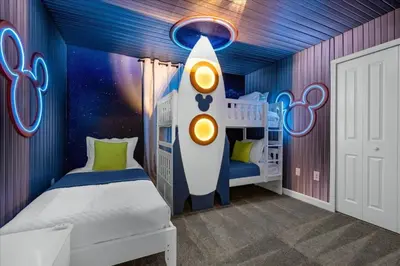 a childs room with a rocket themed bedroom at 5 Bedrooms 4 Bathrooms Storey Lake 2533 Rt in Kissimmee