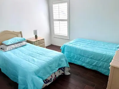 a bedroom with two beds and a window at Brittany - Perfect 3 BR Pool Home in Kissimmee