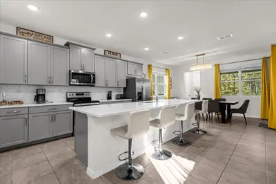 a kitchen with a large white counter top in a room at 6 Bedrooms 5 Bathrooms Solara 1889 Tp in Orlando