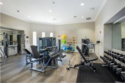 a gym with cardio equipment and treadmills at 3 Bedrooms 2 Bathrooms Vista Cay 4024-203 Bd in Orlando