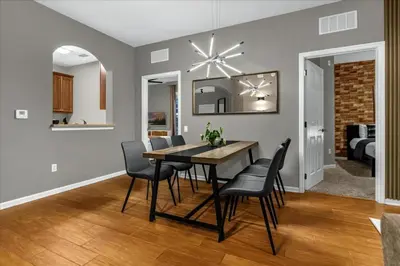 a dining room and living room with a table and chairs at 3 Bedrooms 2 Bathrooms Vista Cay 4024-203 Bd in Orlando