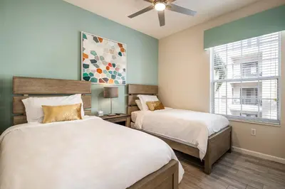 a bedroom with two beds and a window at Near Pool*Balcony*VistaCay Convention Ctr & Idrive in Orlando