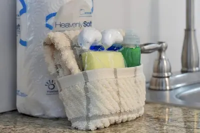 a basket filled with detergent and a bottle of bleach at Enclave Refurbished Condo: Just 2mi to Universal! in Orlando