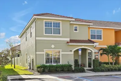 a large house with a street in front of it at Just renovated, private heated pool, resort access in Kissimmee
