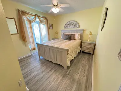 a bedroom with a bed and a ceiling fan at 1589-IBRHAIM · Charming new 4bd in the heart of Kissimmee 1589 in Orlando