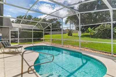 a swimming pool in a house with a pergola at 1589-IBRHAIM · Charming new 4bd in the heart of Kissimmee 1589 in Orlando