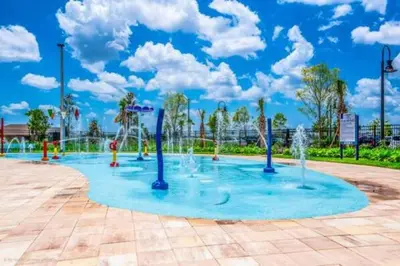 a playground with water fountains in a park at Fancy Family Home 10min-Disney Private Pool STL108 in Kissimmee