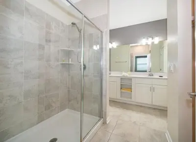a bathroom with a shower and a sink at 3131-403AR STOREY LAKE, CONDO 2/2 LAKE VIEW in Kissimmee