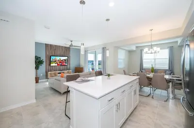 a kitchen and living room with a dining room at 3161-203FC STOREY LAKE, CONDO 2/2 LAKE VIEW in Kissimmee