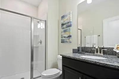 a bathroom with a toilet and a sink and a shower at Last Minute Disney Getaway Private Pool Themed Bedrooms. Book Now 17142 in Kissimmee
