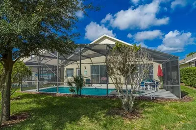 a house with a swimming pool in a yard at 2025 Vacation Savings Secure Your Spot Today in Orlando