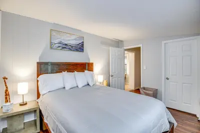 a bedroom with a large white bed with white pillows at Patio and Grill Idyllic Sorrento Vacation Home! in Sorrento