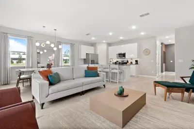 a living room with a couch and a table at Luxury Villa 5BedroomsPool- 4 miles from Disney in Orlando