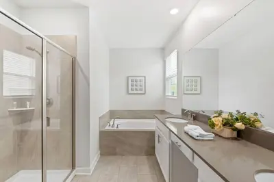 a bathroom with a tub and a sink and a shower at Relax & Unwind Chic Pool Home Near Disney Fun! - STL113 in Kissimmee