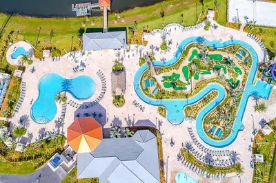 an overhead view of a pool at a resort at Relax & Unwind Chic Pool Home Near Disney Fun! - STL113 in Kissimmee