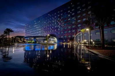 a large building with a bridge in front of it at Universal's Stella Nova Resort in Orlando