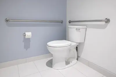 a bathroom with a white toilet in a room at Universal's Stella Nova Resort in Orlando